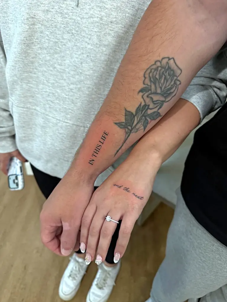 Fine line rose and script tattoo by Madison Roberts at The Archery Collective, Minneapolis